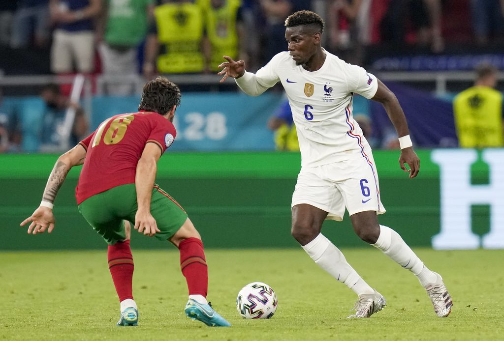 France's Paul Pogba applauds the fans at the end of the Euro 2020 soccer championship group F match between Portugal and France at the Puskas Arena in Budapest, Wednesday, June 23, 2021. The game ended in a 2-2 draw. (Franck Fife, Pool photo via AP)