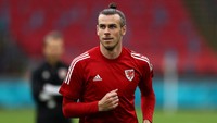 Gareth Bale kembali jadi sorotan, karena ikut ke skuad Timnas Wales di jeda internasional akhir pekan ini walau kondisinya masih cedera otot (Getty Images/Dean Mouhtaropoulos)
