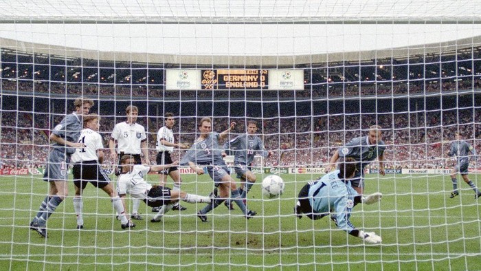 LONDON, ENGLAND - JUNE 26: England striker Alan Shearer ( right) heads in the England goal past goalkeeper Andreas Kopke as team mates Steve McManaman (l) David Platt (6th left) and Teddy Sheringham (c) look on during the 1996 UEFA European Championships semi final at Wembley Stadium on June 26, 1996 in London, United Kingdom. (Photo by Ross Kinnaird/Allsport/Getty Images/Hulton Archive)