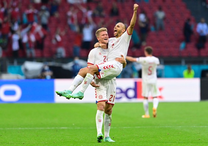 AMSTERDAM, NETHERLANDS - JUNE 26: Andreas Cornelius and Martin Braithwaite of Denmark celebrate their sides victory after the UEFA Euro 2020 Championship Round of 16 match between Wales and Denmark at Johan Cruijff Arena on June 26, 2021 in Amsterdam, Netherlands. (Photo by Olaf Kraak - Pool/Getty Images)