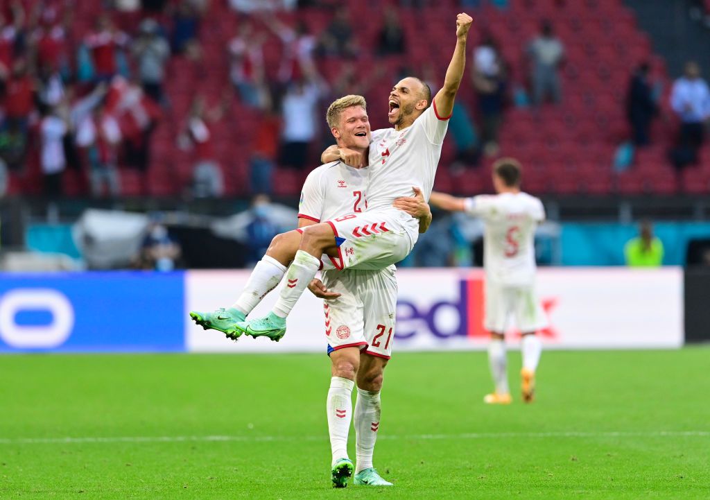 AMSTERDAM, NETHERLANDS - JUNE 26: Andreas Cornelius and Martin Braithwaite of Denmark celebrate their side's victory after the UEFA Euro 2020 Championship Round of 16 match between Wales and Denmark at Johan Cruijff Arena on June 26, 2021 in Amsterdam, Netherlands. (Photo by Olaf Kraak - Pool/Getty Images)