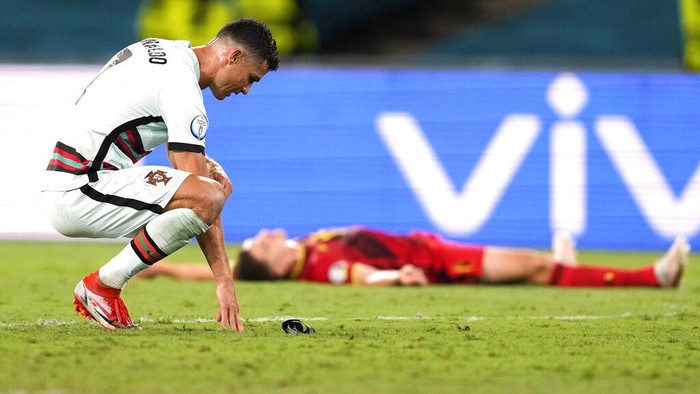 Portugals Cristiano Ronaldo reacts during the Euro 2020 soccer championship round of 16 match between Belgium and Portugal at the La Cartuja stadium in Seville, Spain,Sunday, June 27, 2021. (AP Photo/Thanassis Stavrakis, Pool)