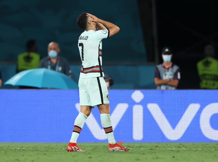 SEVILLE, SPAIN - JUNE 27: Cristiano Ronaldo of Portugal looks dejected following defeat in the UEFA Euro 2020 Championship Round of 16 match between Belgium and Portugal at Estadio La Cartuja on June 27, 2021 in Seville, Spain. (Photo by Alexander Hassenstein/Getty Images)