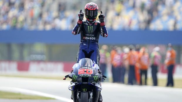 Yamaha rider Fabio Quartararo of France celebrates after winning the MotoGP race at the Dutch Grand Prix in Assen, northern Netherlands, Sunday, June 27, 2021. (AP Photo/Peter Dejong)