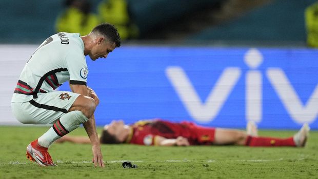 Soccer Football - Euro 2020 - Round of 16 - Belgium v Portugal - La Cartuja Stadium, Seville, Spain - June 27, 2021  Portugal's Cristiano Ronaldo reacts after the match Pool via REUTERS/Thanassis Stavrakis