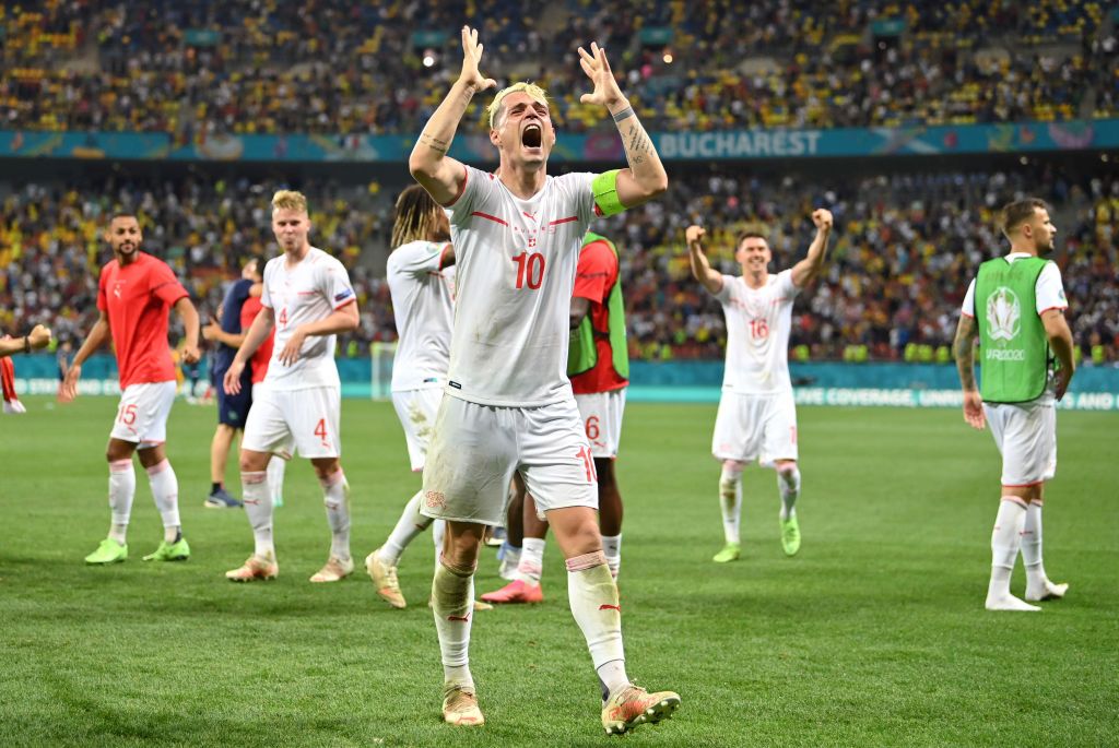 BUCHAREST, ROMANIA - JUNE 28: Granit Xhaka of Switzerland celebrates their side's victory in the penalty shoot out after the UEFA Euro 2020 Championship Round of 16 match between France and Switzerland at National Arena on June 28, 2021 in Bucharest, Romania. (Photo by Justin Setterfield/Getty Images)