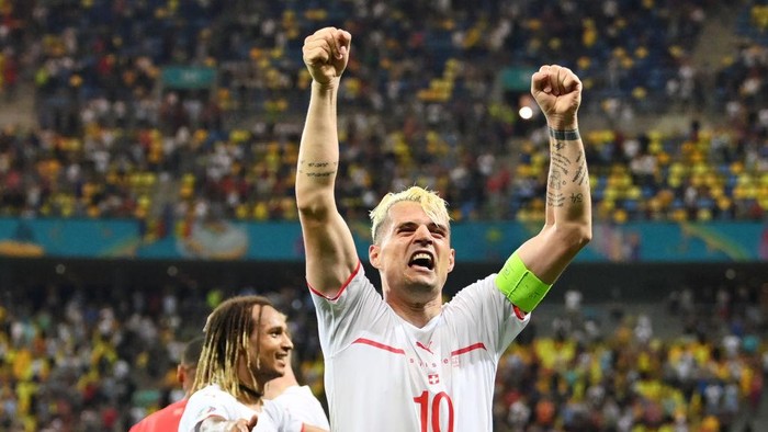 BUCHAREST, ROMANIA - JUNE 28: Granit Xhaka of Switzerland celebrates their sides victory in the penalty shoot out after the UEFA Euro 2020 Championship Round of 16 match between France and Switzerland at National Arena on June 28, 2021 in Bucharest, Romania. (Photo by Justin Setterfield/Getty Images)