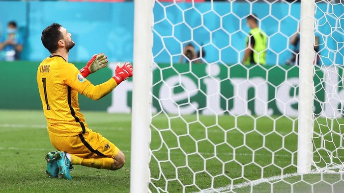 Frances goalkeeper Hugo Lloris reacts after fails to save a penalty shot during the shoot-out during the Euro 2020 soccer championship round of 16 match between France and Switzerland at the National Arena stadium, in Bucharest, Romania, Tuesday, June 29, 2021. (Marko Djurica/Pool Photo via AP)
