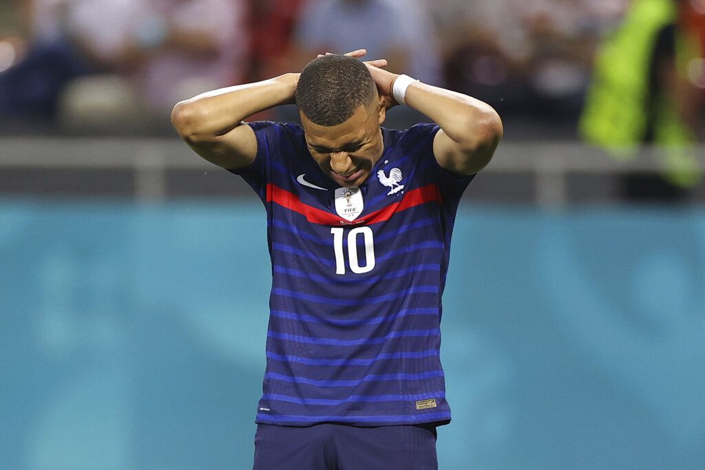 France's Kylian Mbappe reacts after a missed scoring opportunity during the Euro 2020 soccer championship round of 16 match between France and Switzerland at the National Arena stadium, in Bucharest, Romania, Monday, June 28, 2021. (Marko Djurica/Pool Photo via AP)