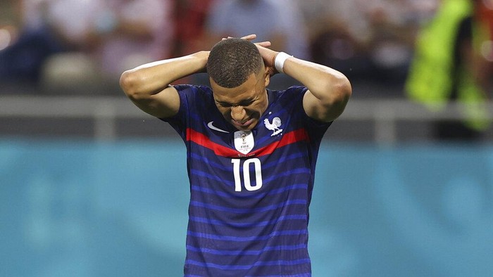Frances Kylian Mbappe reacts after a missed scoring opportunity during the Euro 2020 soccer championship round of 16 match between France and Switzerland at the National Arena stadium, in Bucharest, Romania, Monday, June 28, 2021. (Marko Djurica/Pool Photo via AP)