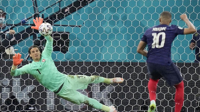 Switzerlands goalkeeper Yann Sommer saves the penalty shot by Frances Kylian Mbappe during the Euro 2020 soccer championship round of 16 match between France and Switzerland at the National Arena stadium in Bucharest, Romania, Tuesday, June 29, 2021. (AP Photo/Vadim Ghirda, Pool)