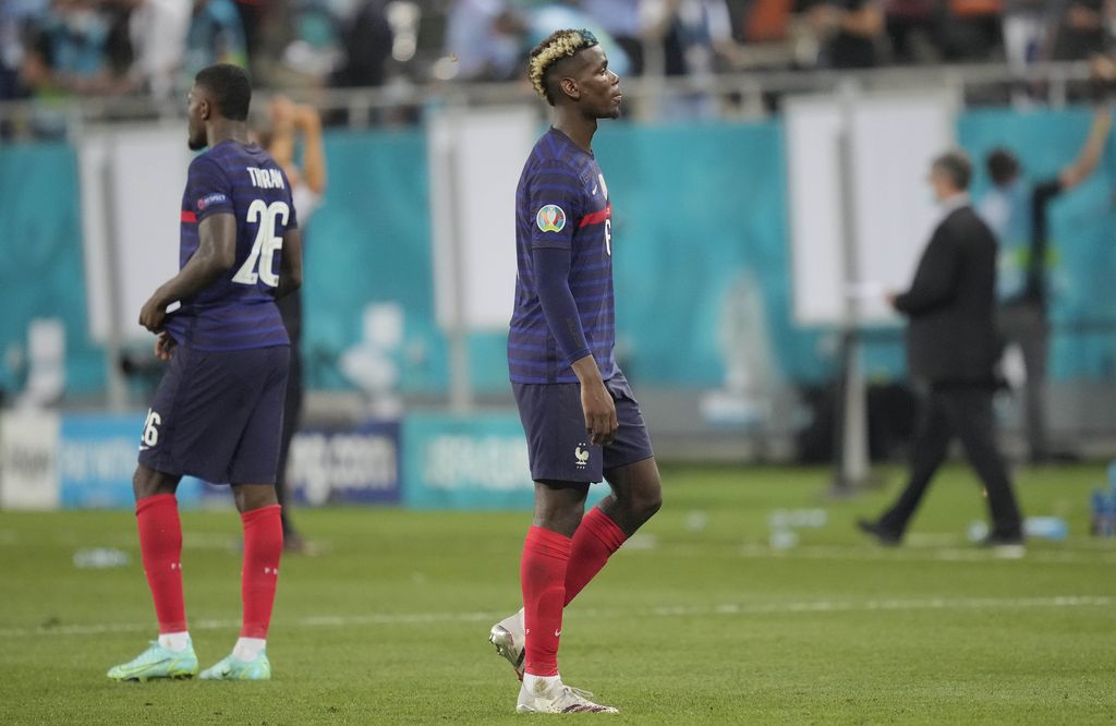 France's Paul Pogba lies on the pitch during the Euro 2020 soccer championship round of 16 match between France and Switzerland at the National Arena stadium in Bucharest, Romania, Tuesday, June 29, 2021. (AP Photo/Vadim Ghirda, Pool)