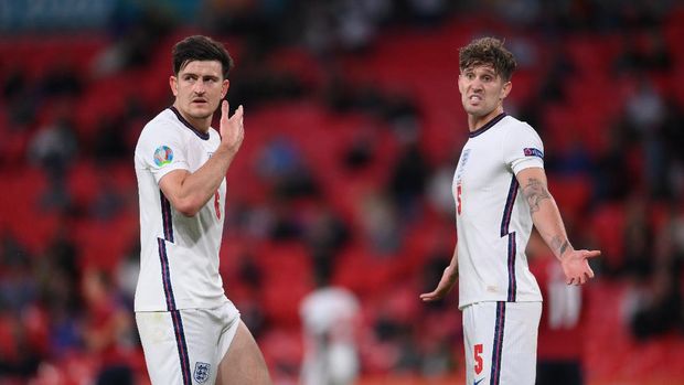 Soccer Football - Euro 2020 - Group D - Czech Republic v England - Wembley Stadium, London, Britain - June 22, 2021 England's John Stones and Harry Maguire react Pool via REUTERS/Laurence Griffiths