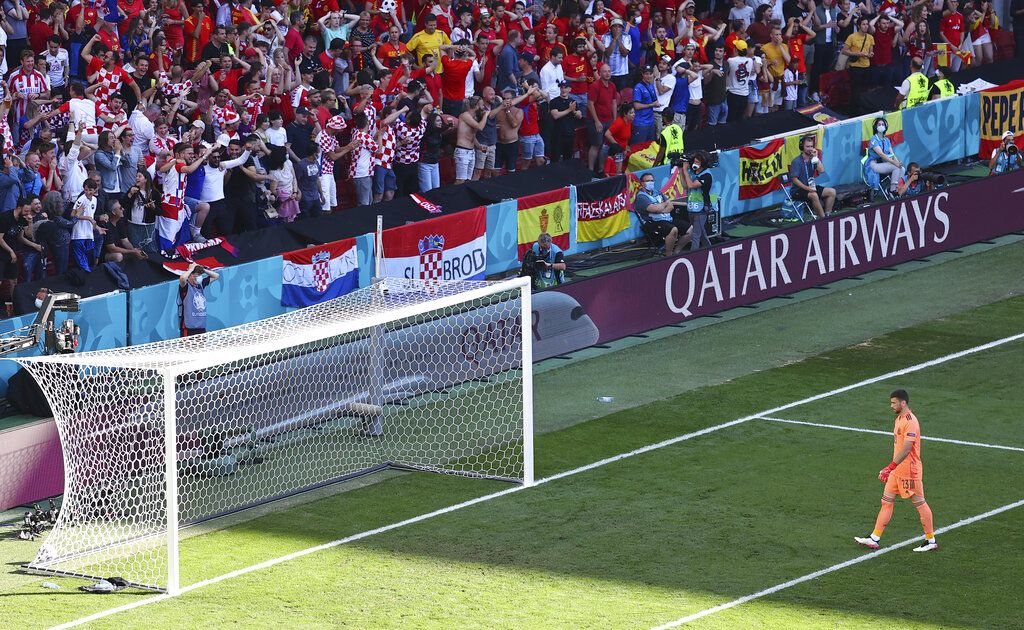 Spain's goalkeeper Unai Simon walks towards the net after conceding an own goal during the Euro 2020 soccer championship round of 16 match between Croatia and Spain, at Parken stadium in Copenhagen, Denmark, Monday, June 28, 2021. (Wolfgang Rattay, Pool via AP)