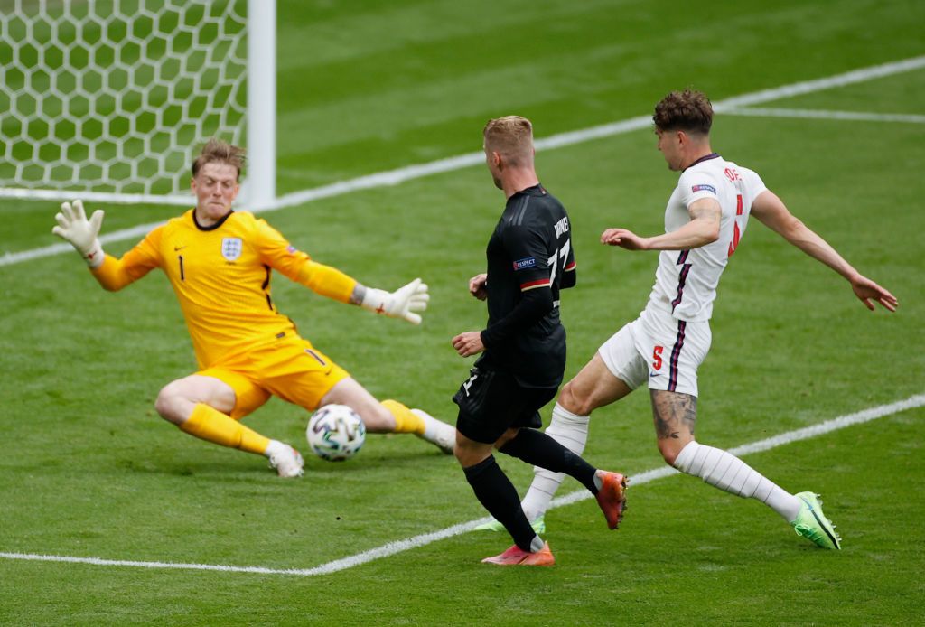 LONDON, ENGLAND - JUNE 29: Timo Werner of Germany has a shot saved by Jordan Pickford of England during the UEFA Euro 2020 Championship Round of 16 match between England and Germany at Wembley Stadium on June 29, 2021 in London, England. (Photo by John Sibley - Pool/Getty Images)