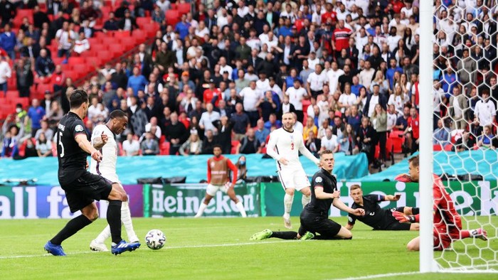 LONDON, ENGLAND - JUNE 29: Raheem Sterling of England scores their sides first goal past Manuel Neuer of Germany during the UEFA Euro 2020 Championship Round of 16 match between England and Germany at Wembley Stadium on June 29, 2021 in London, England. (Photo by Carl Recine - Pool/Getty Images)