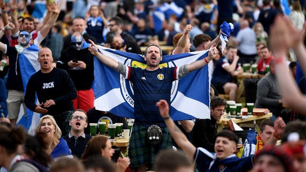 GLASGOW, SCOTLAND - JUNE 18: Scotland fans react as they support their team in the Euro 2020 game against England on June 18, 2021 in Glasgow, Scotland. England V Scotland is not only the oldest fixture in the world, they have also played one another more than any other two international teams. Their first encounter was played in 1872 at Hamilton Crescent, Glasgow and their 115th match today at Wembley for Euro 2020. (Photo by Jeff J Mitchell/Getty Images)