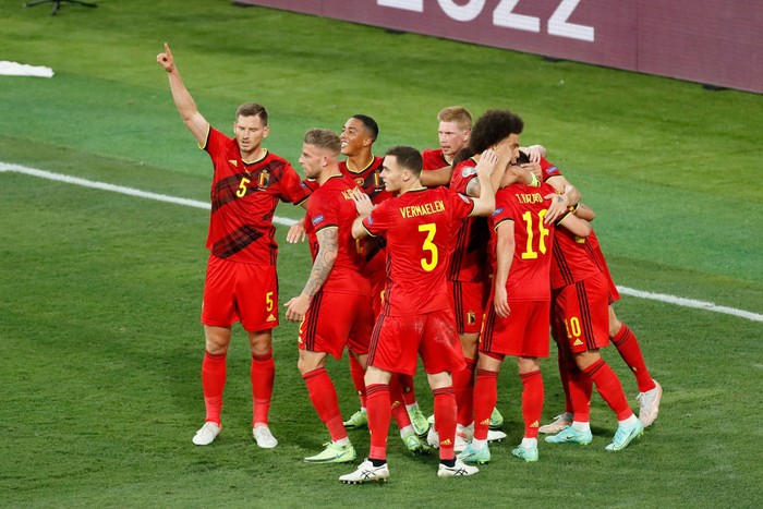 SEVILLE, SPAIN - JUNE 27: Thorgan Hazard of Belgium celebrates with team mates after scoring their sides first goal during the UEFA Euro 2020 Championship Round of 16 match between Belgium and Portugal at Estadio La Cartuja on June 27, 2021 in Seville, Spain. (Photo by Jose Manuel Vidal - Pool/Getty Images)