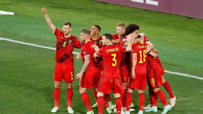 SEVILLE, SPAIN - JUNE 27: Thorgan Hazard of Belgium celebrates with team mates after scoring their sides first goal during the UEFA Euro 2020 Championship Round of 16 match between Belgium and Portugal at Estadio La Cartuja on June 27, 2021 in Seville, Spain. (Photo by Jose Manuel Vidal - Pool/Getty Images)