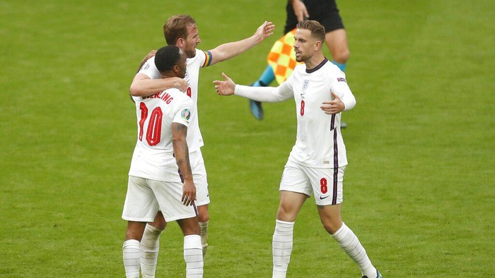 Englands Raheem Sterling, left, Harry Kane, center, scorers of the two goals celebrate with Jordan Henderson after the Euro 2020 soccer championship round of 16 match between England and Germany, at Wembley stadium, in London, Tuesday, June 29, 2021. England won 2-0. (Matthew Childs/Pool via AP)
