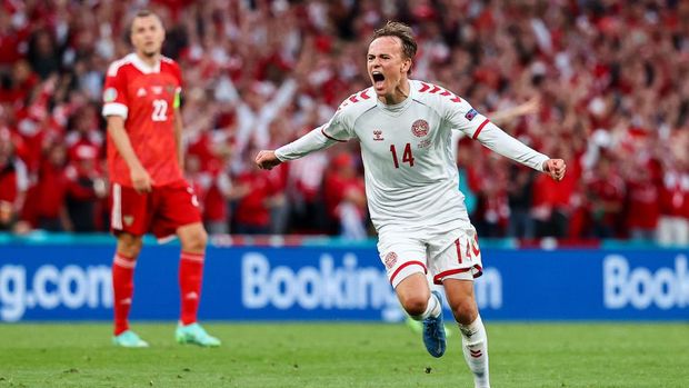 COPENHAGEN, DENMARK - JUNE 21: Mikkel Damsgaard of Denmark celebrates after scoring their side's first goal during the UEFA Euro 2020 Championship Group B match between Russia and Denmark at Parken Stadium on June 21, 2021 in Copenhagen, Denmark. (Photo by Wolfgang Rattay - Pool/Getty Images)