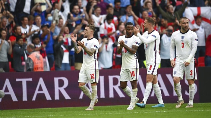 From left, Englands Kieran Trippier, Raheem Sterling, Jordan Henderson and Luke Shaw celebrate at the end of the Euro 2020 soccer championship round of 16 match between England and Germany, at Wembley stadium in London, Tuesday, June 29, 2021. England won 2-0. (Andy Rain, Pool via AP)