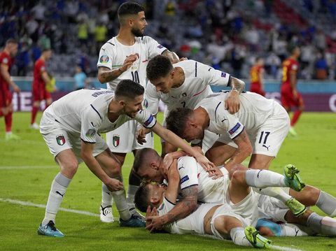Italian teammates celebrate scoring the opening goal during the Euro 2020 soccer championship quarterfinal match between Belgium and Italy at the Allianz Arena stadium in Munich, Germany, Friday, July 2, 2021. (AP Photo/Matthias Schrader, Pool)