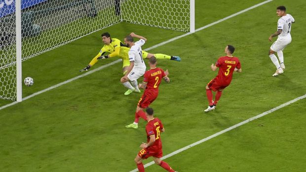 Italy's Leonardo Bonucci, centre, scores a goal that is disallowed for off-side during the Euro 2020 soccer championship quarterfinal match between Belgium and Italy at the Allianz Arena in Munich, Germany, Friday, July 2, 2021. (Stuart Franklin/Pool Photo via AP)