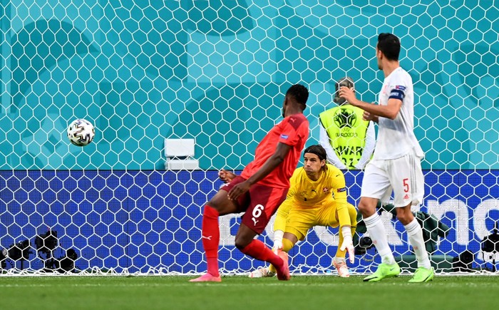 SAINT PETERSBURG, RUSSIA - JULY 02: The ball deflects off Denis Zakaria of Switzerland past Yann Sommer leading to the Spain first goal scored by Jordi Alba during the UEFA Euro 2020 Championship Quarter-final match between Switzerland and Spain at Saint Petersburg Stadium on July 02, 2021 in Saint Petersburg, Russia. (Photo by Kirill Kudryavstev - Pool/Getty Images)