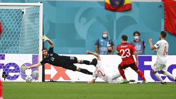 Switzerland's Xherdan Shaqiri scores his side's opening goal during the Euro 2020 soccer championship quarterfinal match between Switzerland and Spain, at the Saint Petersburg stadium in Saint Petersburg, Friday, July 2, 2021. (Kirill Kudryavtsev, Pool via AP)