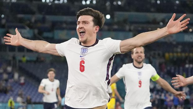 England's Harry Maguire celebrates after scoring his side's second goal during the Euro 2020 soccer championship quarterfinal match between Ukraine and England at the Olympic stadium in Rome at the Olympic stadium in Rome, Italy, Saturday, July 3, 2021. (AP Photo/Alessandra Tarantino, Pool)