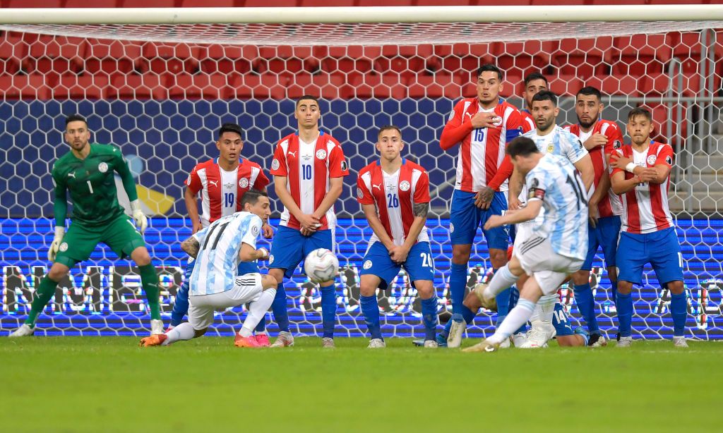 GOIANIA, BRAZIL - JULY 03: Lionel Messi of Argentina prepares to take a free kick kick during a quarter-final match of Copa America Brazil 2021 between Argentina and Ecuador at Estadio Olimpico on July 03, 2021 in Goiania, Brazil. (Photo by Pedro Vilela/Getty Images)