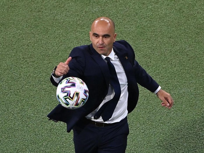 MUNICH, GERMANY - JULY 02: Roberto Martinez, Head Coach of Belgium attempts to catch the Adidas Uniforia match ball during the UEFA Euro 2020 Championship Quarter-final match between Belgium and Italy at Football Arena Munich on July 02, 2021 in Munich, Germany. (Photo by Stuart Franklin/Getty Images)