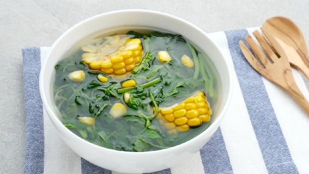 Sayur Bening Bayam, Spinach Clear Vegetable. Indonesian food of spinach, spinach soup with corn.