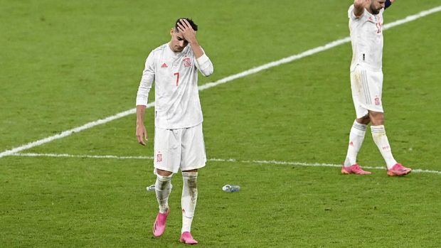 Spain's Alvaro Morata and Jordi Alba, right, react at the end of the Euro 2020 soccer championship semifinal match between Italy and Spain at Wembley stadium in London, Tuesday, July 6, 2021. Italy defeated Spain 4-2 in a penalty shootout after the game ended tied 1-1 after extra time.(Facundo Arrizabalaga/Pool Photo via AP)