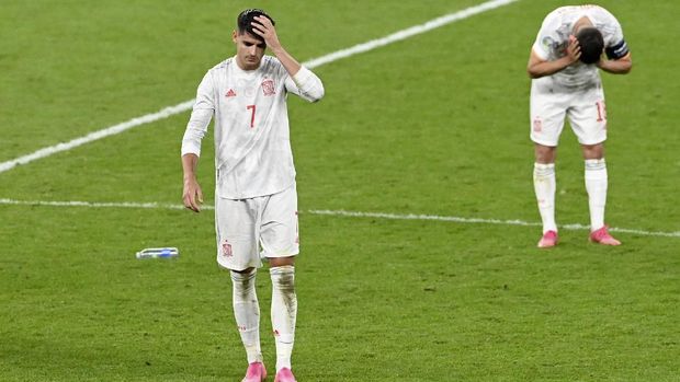Spain's Alvaro Morata and Jordi Alba, right, react at the end of the Euro 2020 soccer championship semifinal match between Italy and Spain at Wembley stadium in London, Tuesday, July 6, 2021. Italy defeated Spain 4-2 in a penalty shootout after the game ended tied 1-1 after extra time.(Facundo Arrizabalaga/Pool Photo via AP)