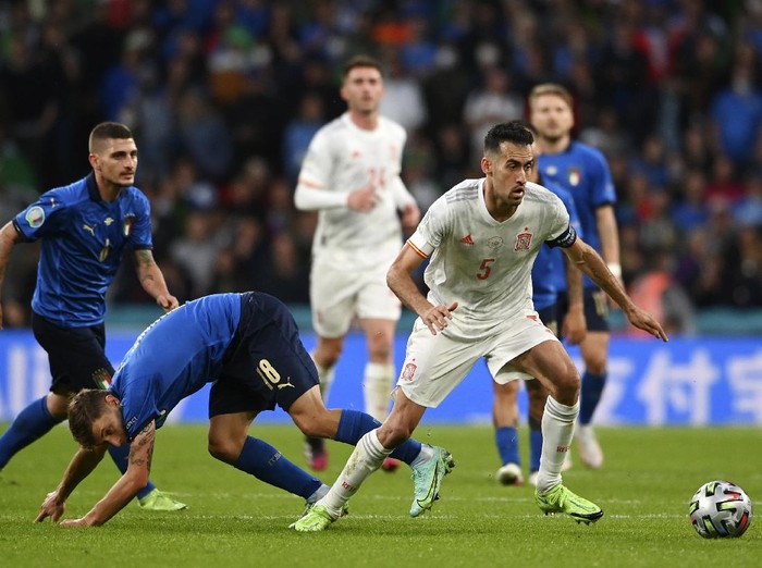Spains Sergio Busquets tries to control the ball during the Euro 2020 soccer championship semifinal match between Italy and Spain at Wembley Stadium in London, Tuesday, July 6, 2021. (Andy Rain/Pool via AP)