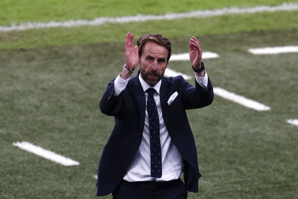 England's manager Gareth Southgate applauds the fans at the end of the Euro 2020 soccer championship semifinal match between England and Denmark at Wembley stadium in London, Wednesday, July 7, 2021. England won 2-1. (Catherine Ivill/Pool Photo via AP)
