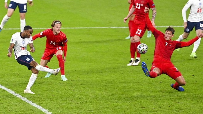 England's Harry Kane, right, reacts after scoring his team's second goal during the Euro 2020 soccer championship semifinal between England and Denmark at Wembley stadium in London, Wednesday, July 7, 2021. (Justin Tallis/Pool Photo via AP)