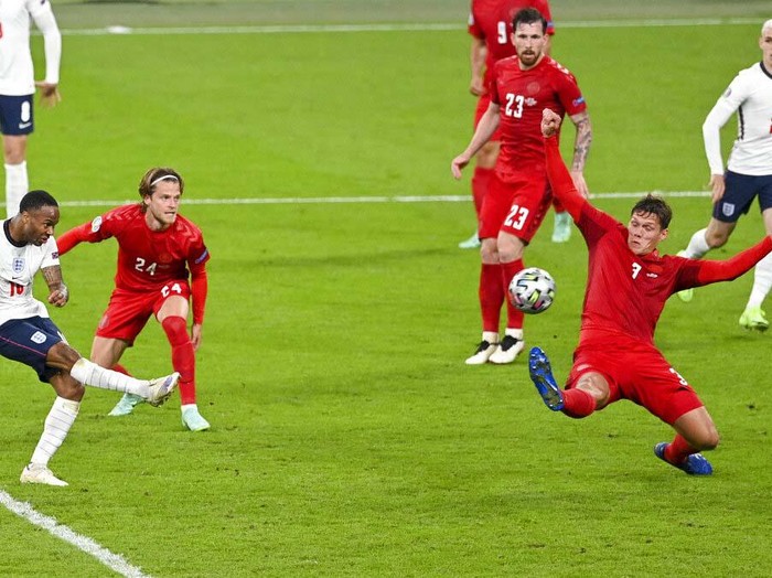 England's Harry Kane, right, reacts after scoring his team's second goal during the Euro 2020 soccer championship semifinal between England and Denmark at Wembley stadium in London, Wednesday, July 7, 2021. (Justin Tallis/Pool Photo via AP)