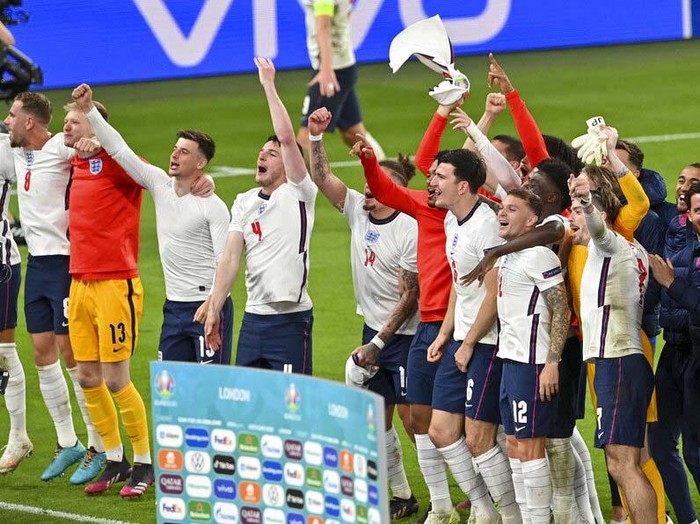 England's Harry Kane, right, reacts after scoring his team's second goal during the Euro 2020 soccer championship semifinal between England and Denmark at Wembley stadium in London, Wednesday, July 7, 2021. (Justin Tallis/Pool Photo via AP)