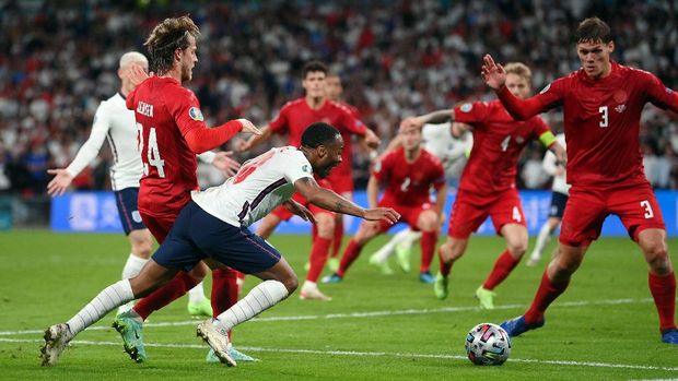 Soccer Football - Euro 2020 - Semi Final - England v Denmark - Wembley Stadium, London, Britain - July 7, 2021 Denmark's Joakim Maehle fouls England's Raheem Sterling to concede a penalty Pool via REUTERS/Laurence Griffiths