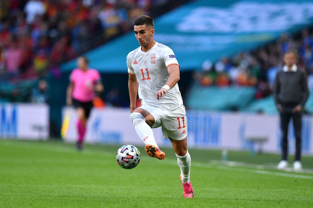 LONDON, ENGLAND - JULY 06: Pedri of Spain is consoled by team mates Thiago Alcantara and Marcos Llorente following defeat in the UEFA Euro 2020 Championship Semi-final match between Italy and Spain at Wembley Stadium on July 06, 2021 in London, England. (Photo by Andy Rain - Pool/Getty Images)