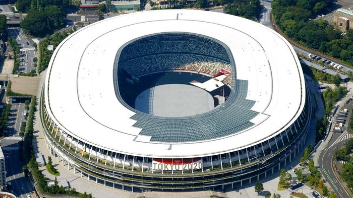 This aerial photo shows the National Stadium in Tokyo, Japan Monday, June 21, 2021. Fans will be banned from Tokyo-area stadiums and arenas when the Olympics begin in two weeks, the city’s governor said Thursday after meeting with organizers of the pandemic-postponed games.(Kyodo News via AP)