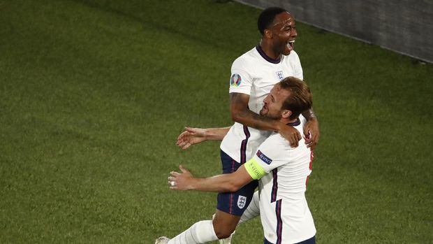 England's Harry Kane, right, celebrates with England's Raheem Sterling after scoring his side's third goal during the Euro 2020 soccer championship quarterfinal match between Ukraine and England at the Olympic stadium in Rome, Italy, Saturday, July 3, 2021. (Alessandro Garofalo/Pool Via AP)