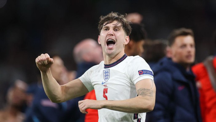 LONDON, ENGLAND - JULY 07: John Stones of England celebrates their sides victory after the UEFA Euro 2020 Championship Semi-final match between England and Denmark at Wembley Stadium on July 07, 2021 in London, England. (Photo by Carl Recine - Pool/Getty Images)