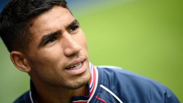 Paris Saint-Germains new player, Moroccan defender Achraf Hakimi looks on ahead of press conference at the Parc des Princes stadium in Paris on July 8, 2021. (Photo by FRANCK FIFE / AFP)
