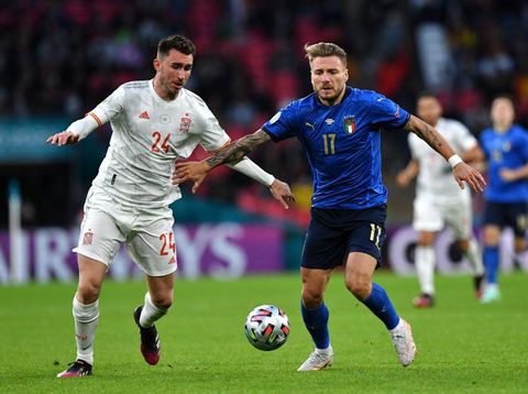 LONDON, ENGLAND - JULY 06: Aymeric Laporte of Spain battles for possession with Ciro Immobile of Italy during the UEFA Euro 2020 Championship Semi-final match between Italy and Spain at Wembley Stadium on July 06, 2021 in London, England. (Photo by Justin Tallis - Pool/Getty Images)