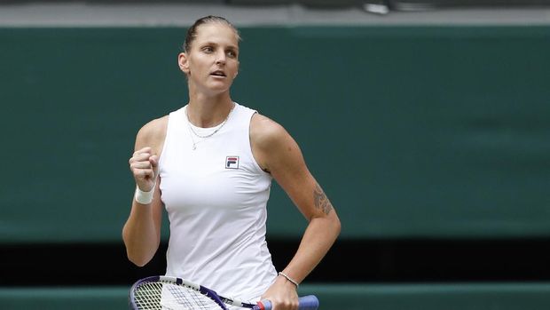 Czech Republic's Karolina Pliskova reacts after winning the second set as she plays against Australia's Ashleigh Barty during the women's singles final on day twelve of the Wimbledon Tennis Championships in London, Saturday, July 10, 2021.(Pete Nichols/Pool Via AP)