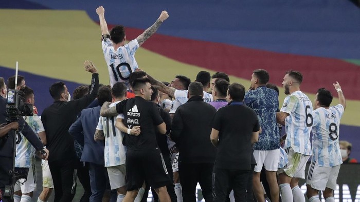 Argentinas Lionel Messi, above, celebrates with his team after beating 1-0 Brazil in the Copa America final soccer match at the Maracana stadium in Rio de Janeiro, Brazil, Saturday, July 10, 2021. (AP Photo/Andre Penner)